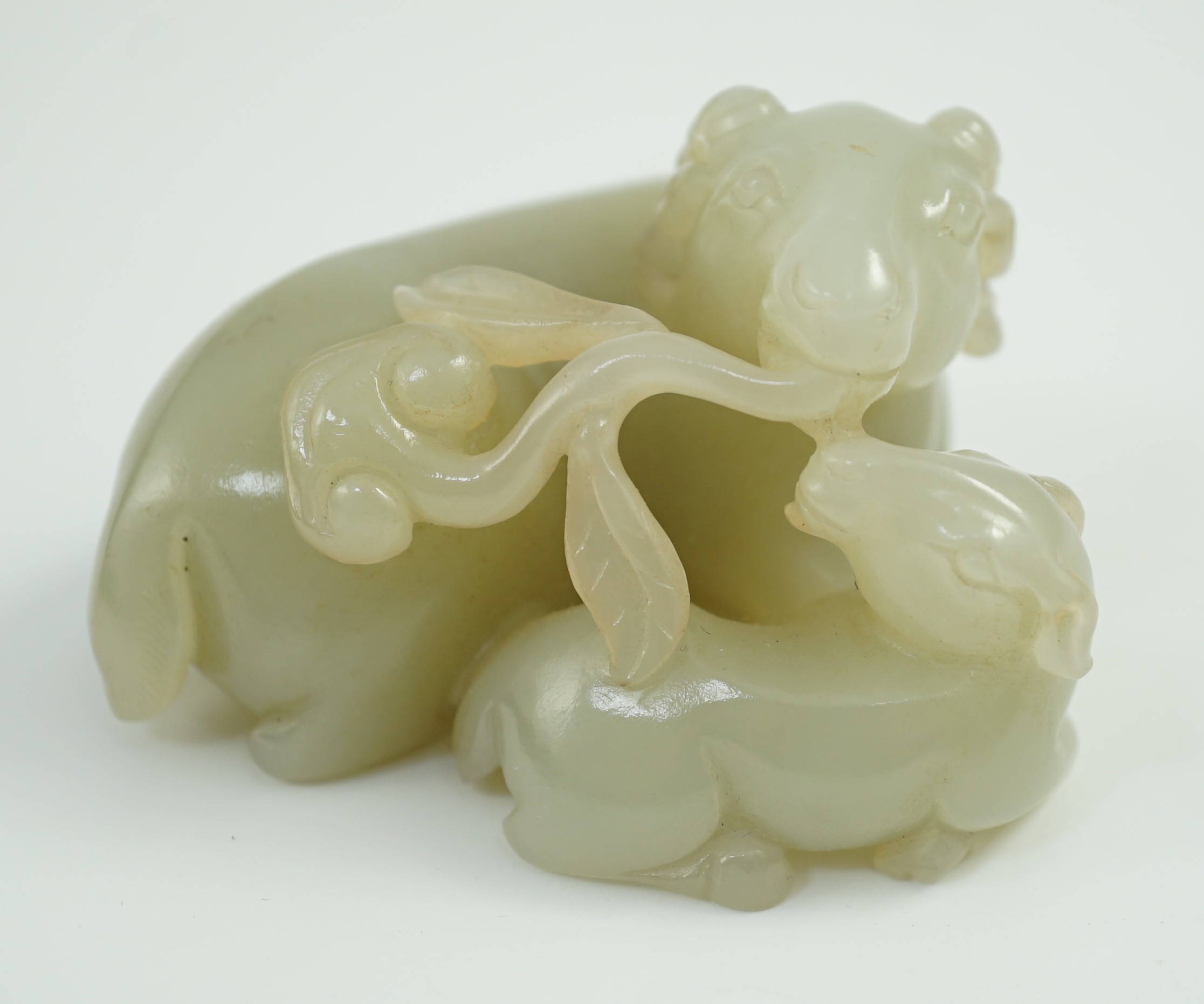 A Chinese pale celadon jade ram group, 7cm long